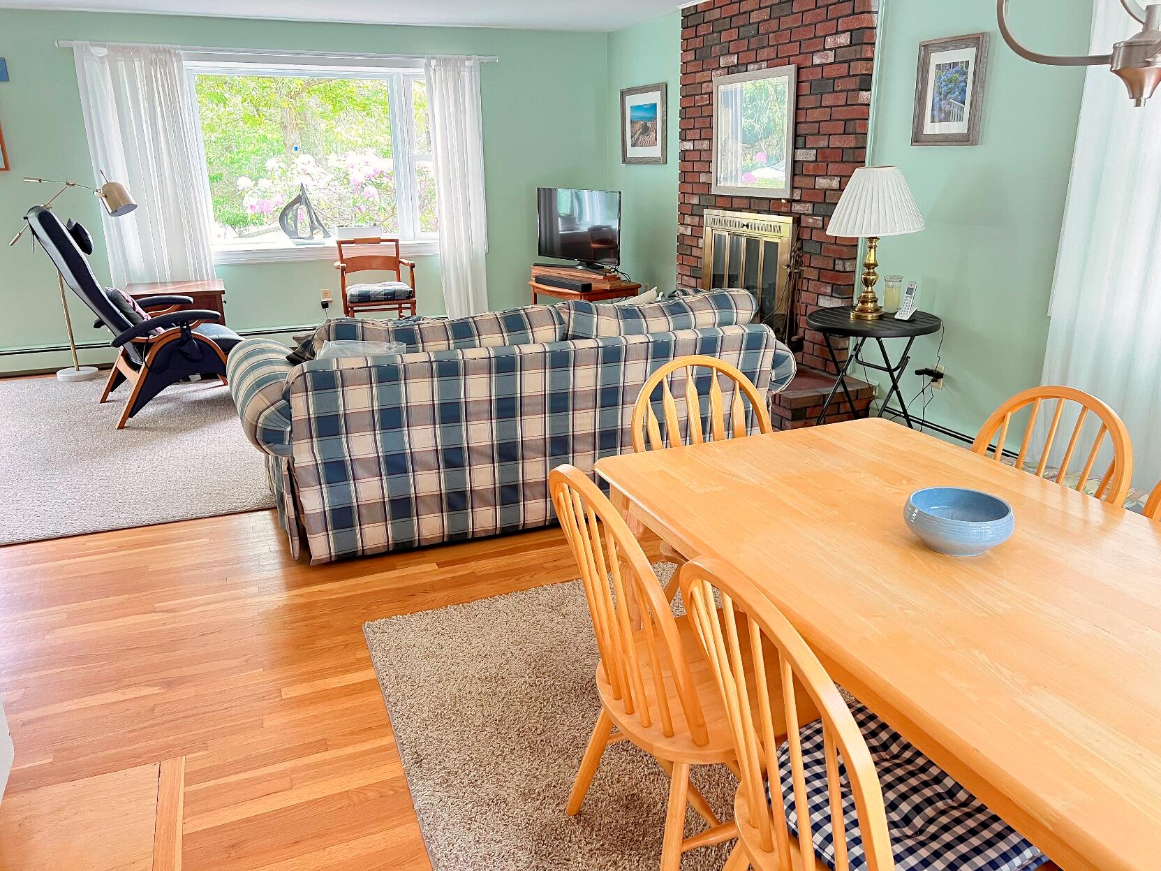 199 Timberlane Drive Brewster, MA 02631 - Photo 22 of 44 a dining room with furniture and a large window