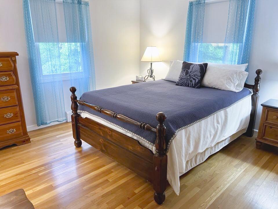 199 Timberlane Drive Brewster, MA 02631 - Photo 24 of 44 a bedroom with a bed and a window