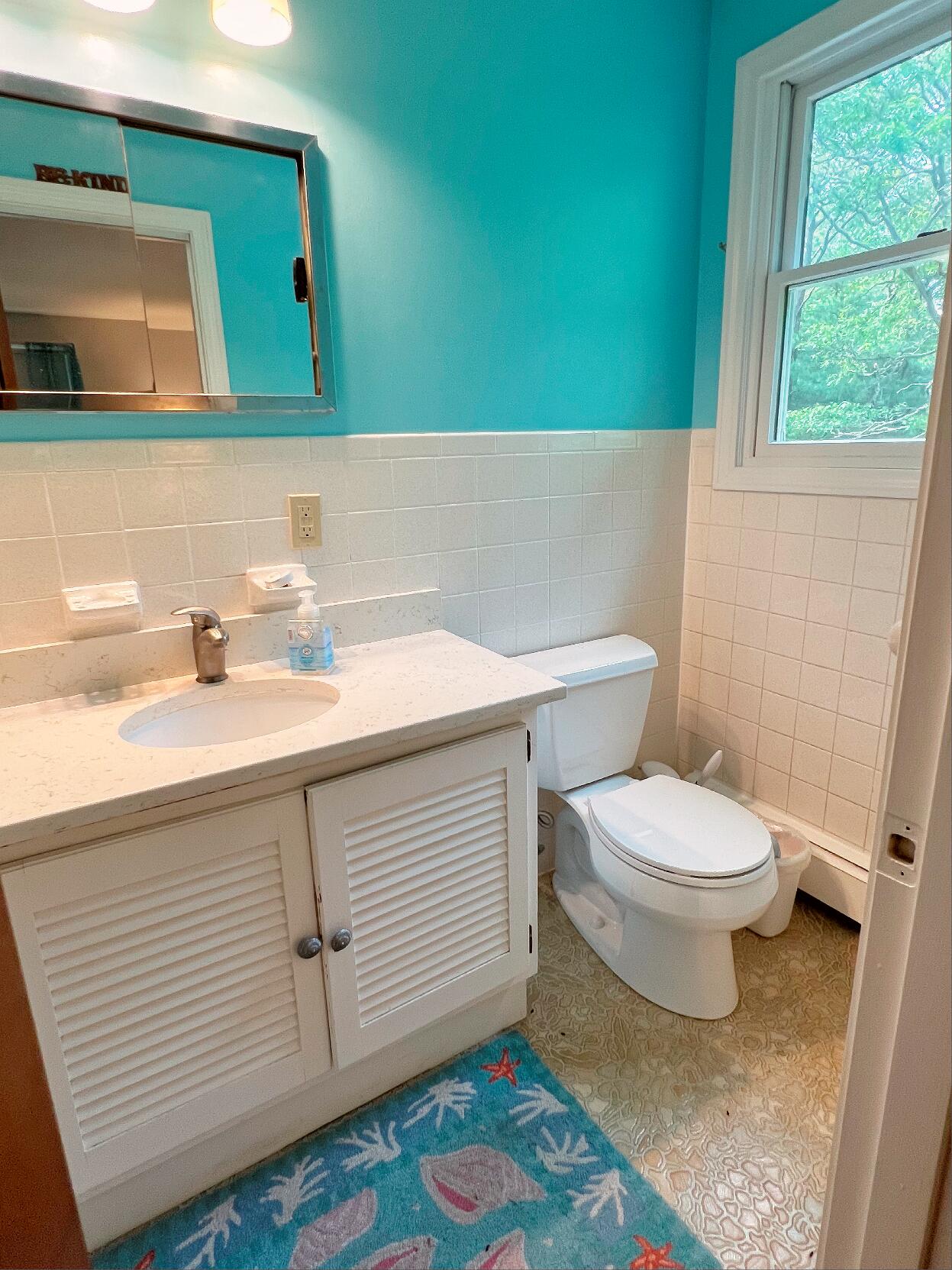 199 Timberlane Drive Brewster, MA 02631 - Photo 27 of 44 a bathroom with a sink and a toilet