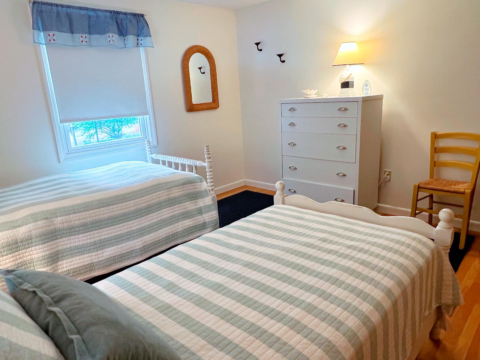 199 Timberlane Drive Brewster, MA 02631 - Photo 29 of 44 a bedroom with a bed and a dresser