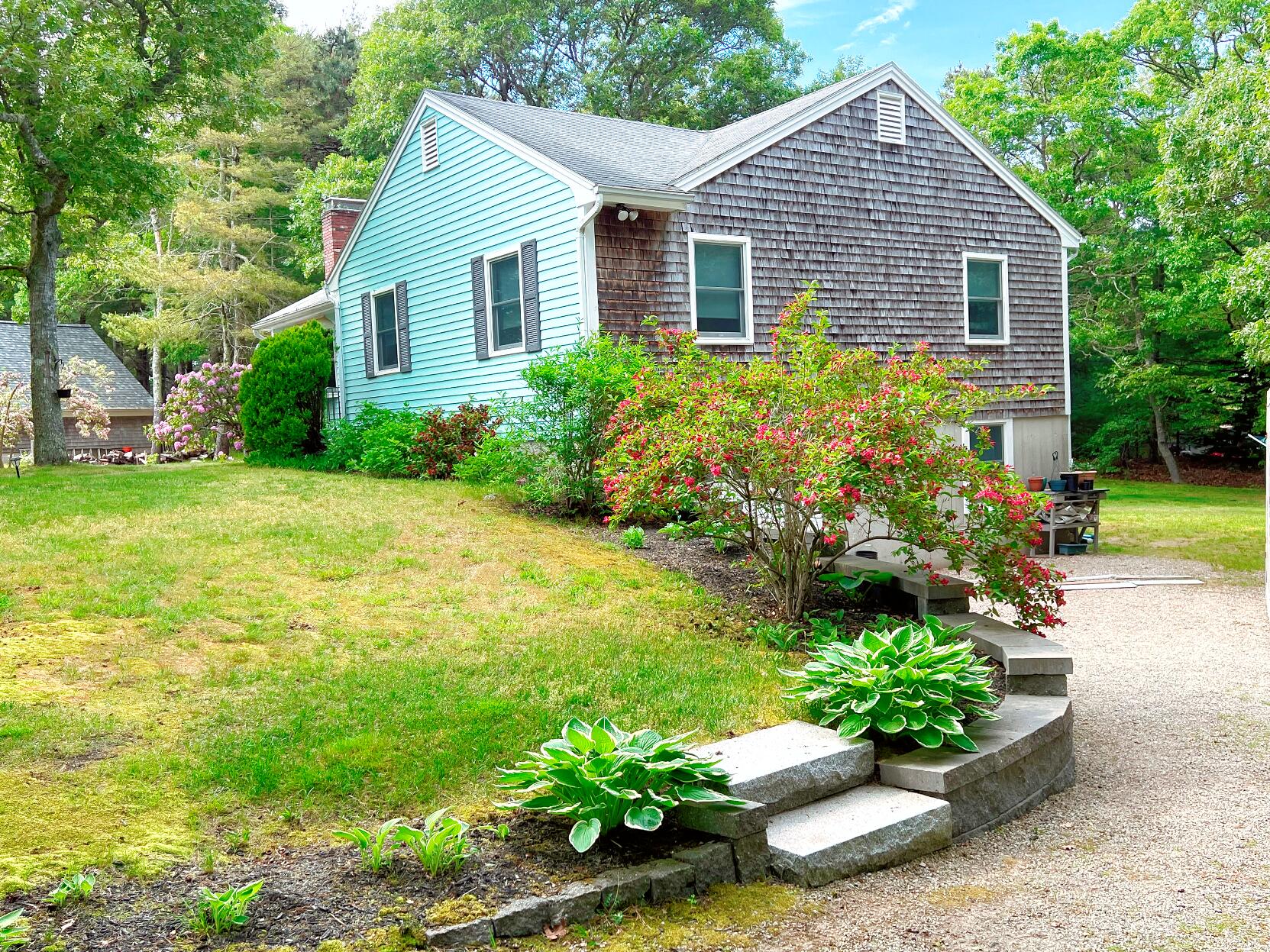 199 Timberlane Drive Brewster, MA 02631 - Photo 3 of 44 a front view of a house with a yard
