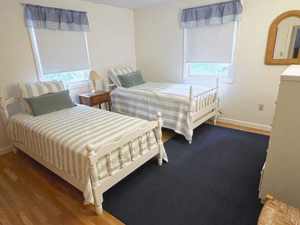 199 Timberlane Drive Brewster, MA 02631 - Photo 31 of 44 a bedroom with two beds and a table