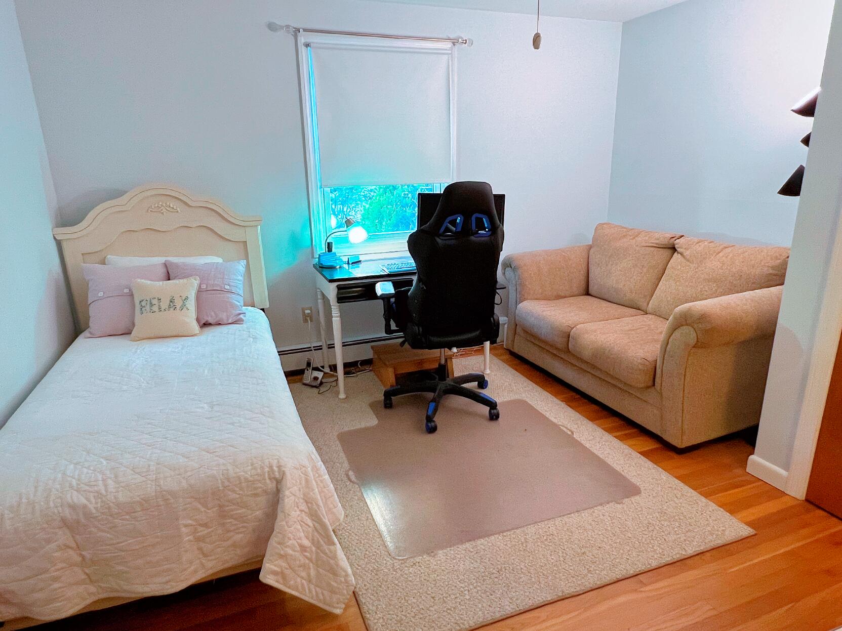 199 Timberlane Drive Brewster, MA 02631 - Photo 32 of 44 a living room with furniture rug and a window