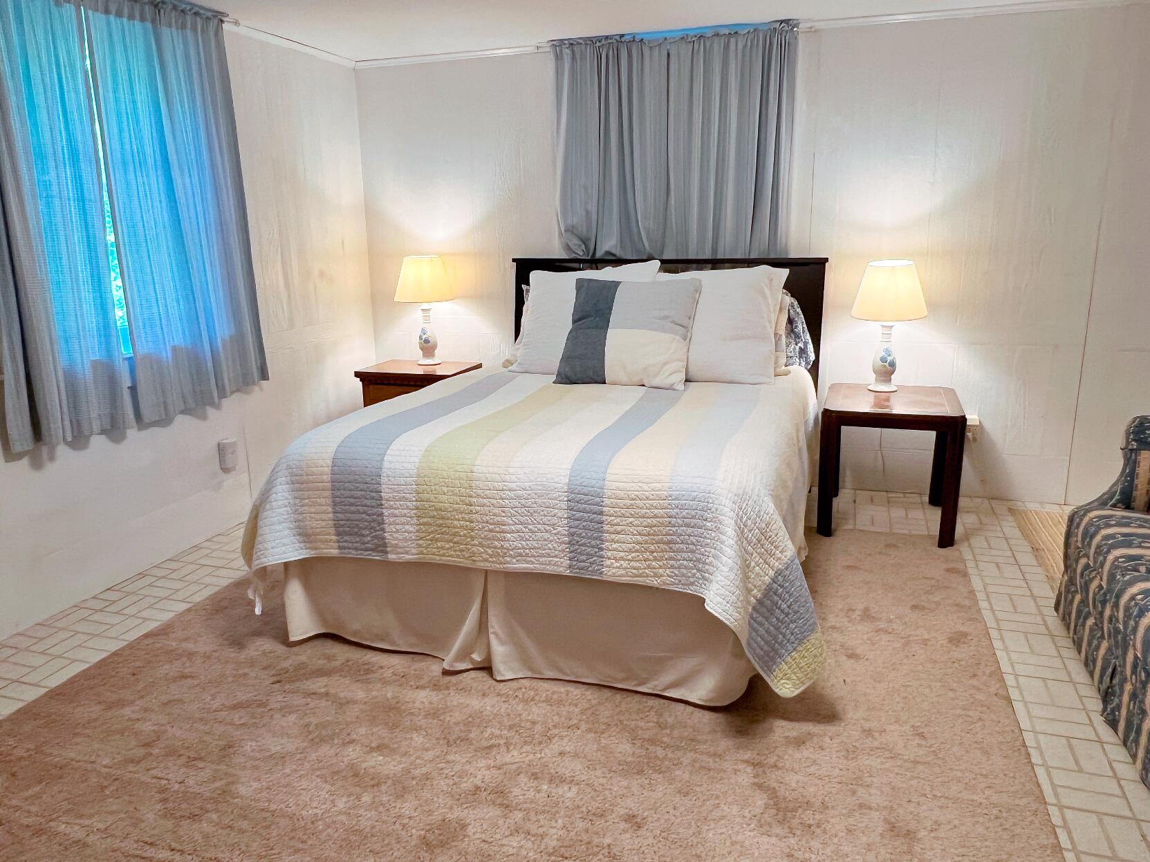 199 Timberlane Drive Brewster, MA 02631 - Photo 36 of 44 a bedroom with a bed and a window