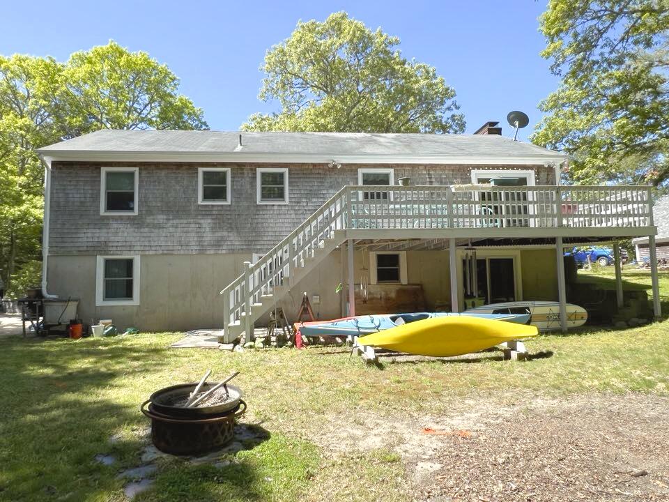 199 Timberlane Drive Brewster, MA 02631 - Photo 6 of 44 a swimming pool with outdoor seating and yard