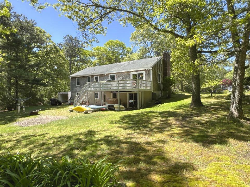 199 Timberlane Drive Brewster, MA 02631 - Photo 10 of 44 a view of a house with pool and trees