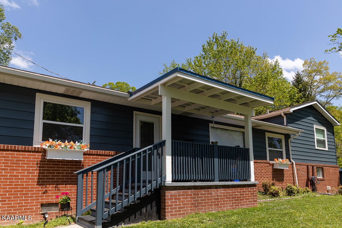 108 East Malta Road Oak Ridge, TN 37830 - Photo 1 of 53 a front view of house with yard