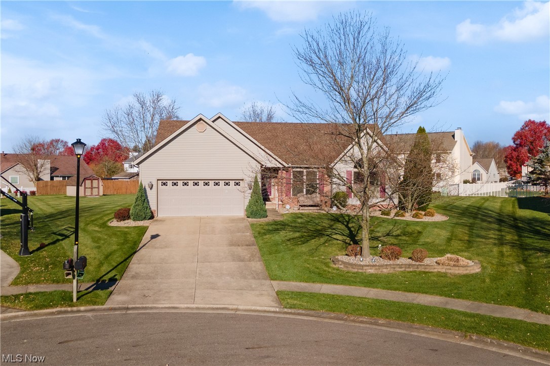 8366 Turquoise Avenue Northeast Canton, OH 44721 - Photo 1 of 26 Single story home featuring a garage and a front yard