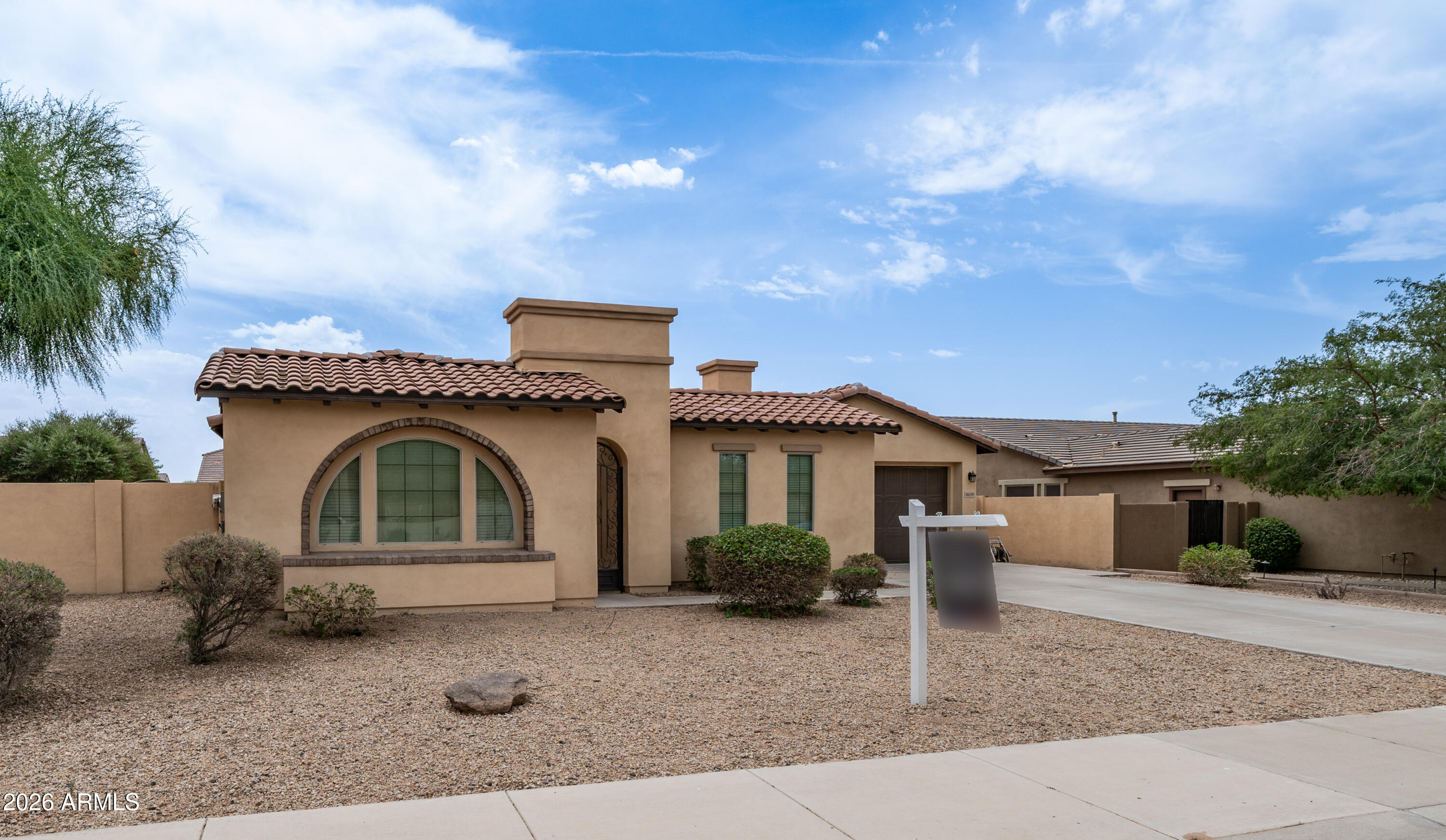 16159 West Granada Road Goodyear, AZ 85395 - Photo 41 of 41 a front view of a house with garden