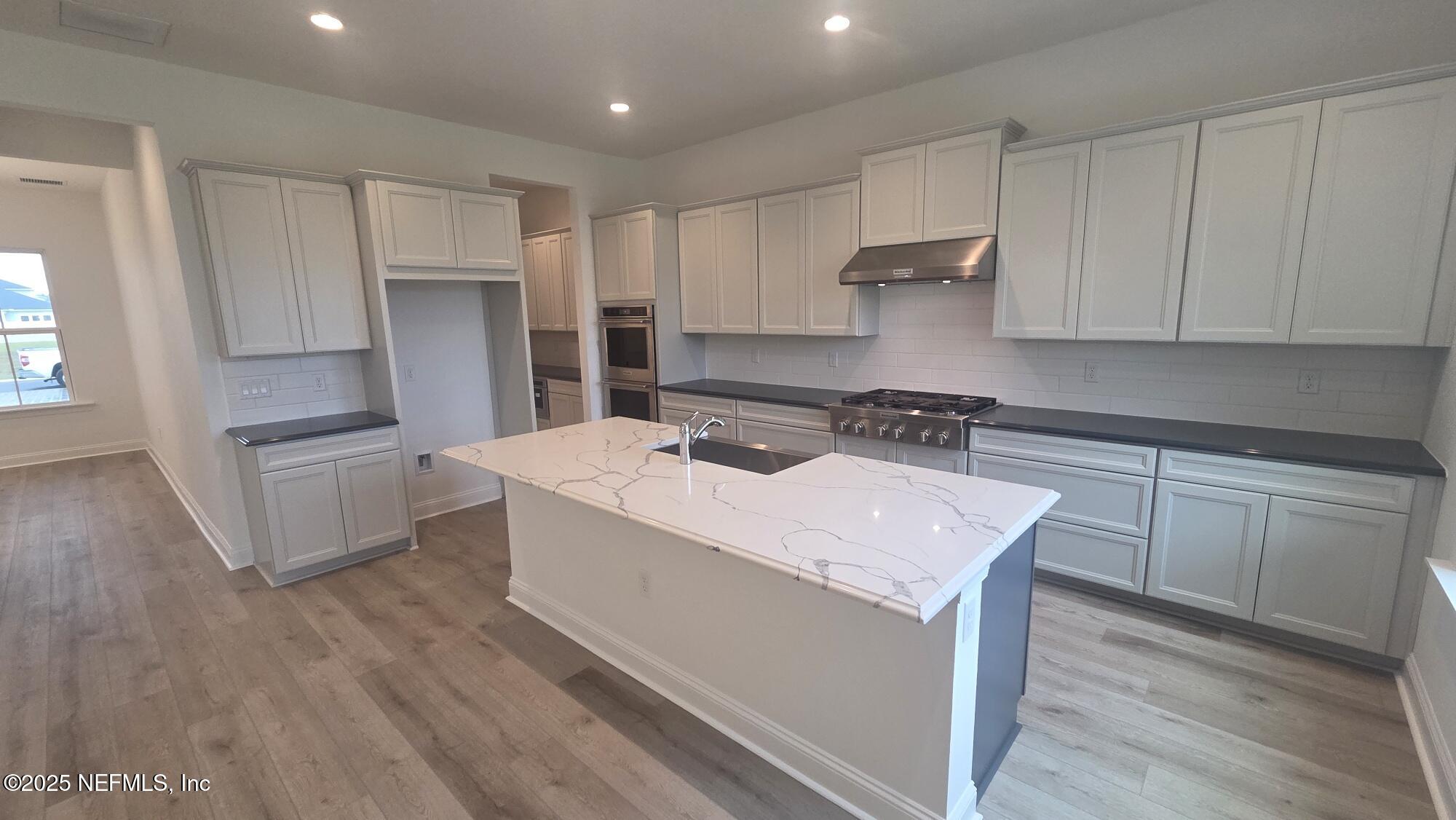 74 Sapling Terrace St. Johns, FL 32259 - Photo 17 of 39 a kitchen with a sink stove and refrigerator
