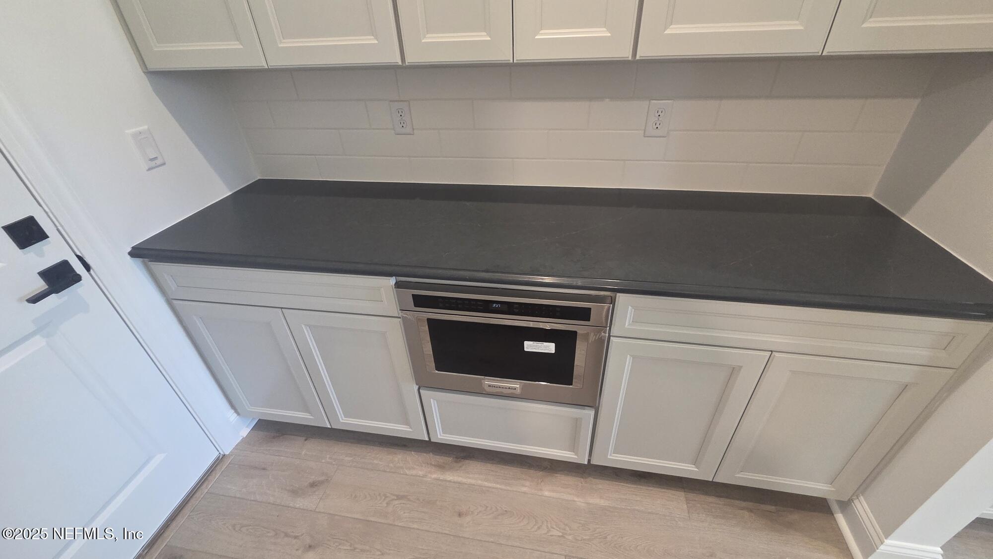 74 Sapling Terrace St. Johns, FL 32259 - Photo 28 of 49 a stove top oven sitting inside of a kitchen