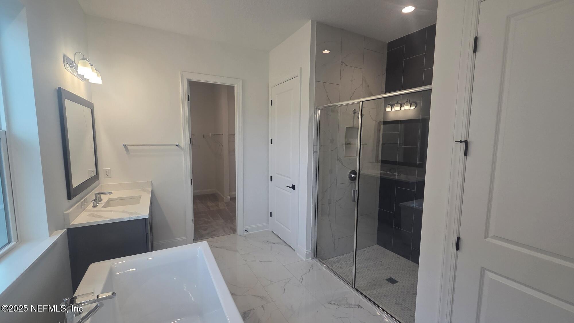 74 Sapling Terrace St. Johns, FL 32259 - Photo 34 of 49 a bathroom with a shower and a sink