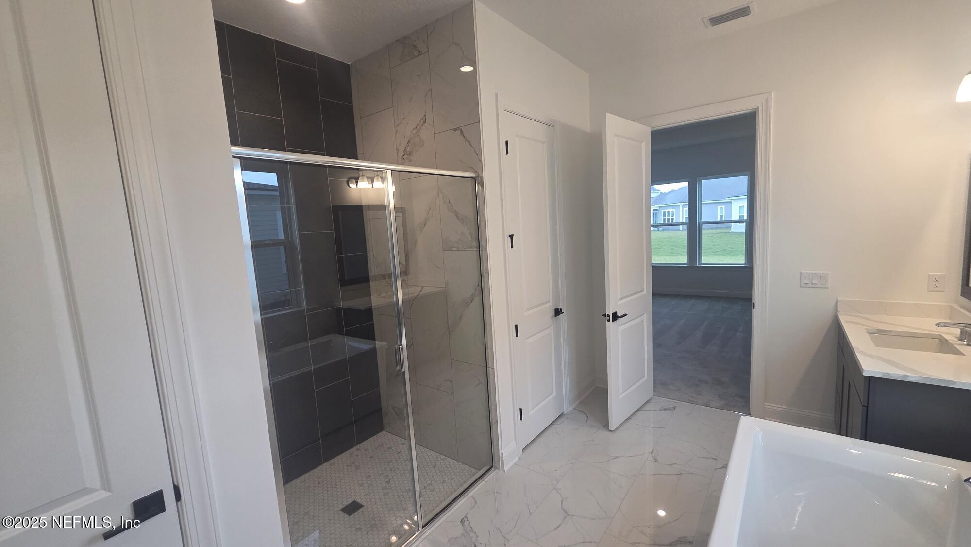 74 Sapling Terrace St. Johns, FL 32259 - Photo 36 of 49 a bathroom with a shower and a sink