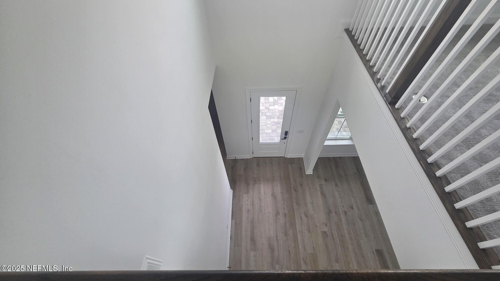 74 Sapling Terrace St. Johns, FL 32259 - Photo 45 of 49 a view of a hallway with wooden floor and staircase