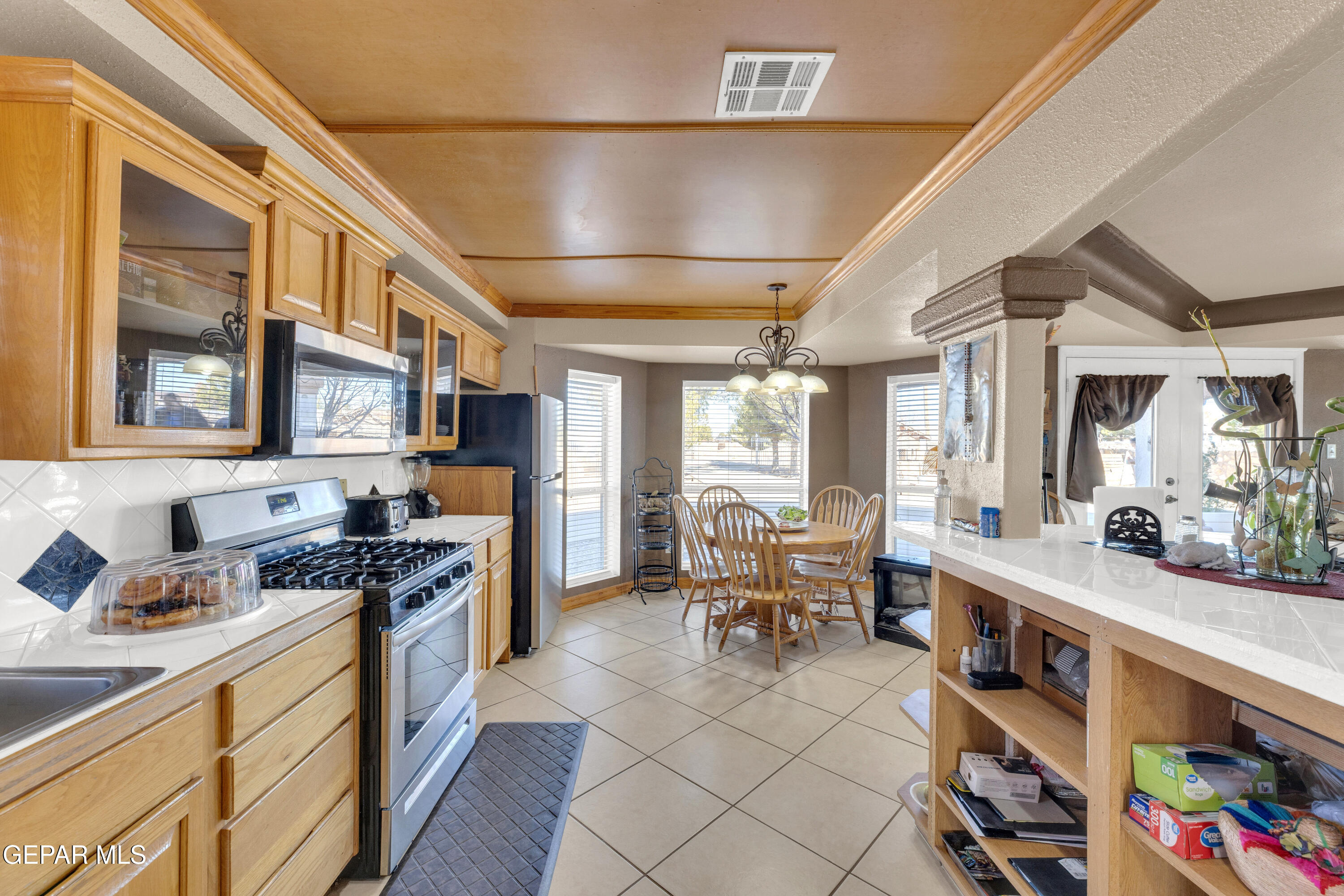 16020 Harrison Road El Paso, TX 79928 - Photo 15 of 56 a kitchen with stainless steel appliances granite countertop a stove and cabinets