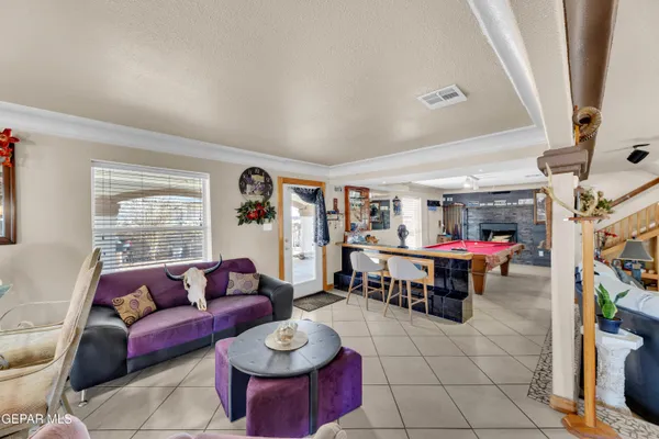 a very nice looking living room with lots of furniture and a large window
