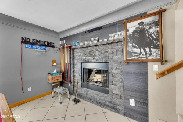 a room with pool table and flat screen tv