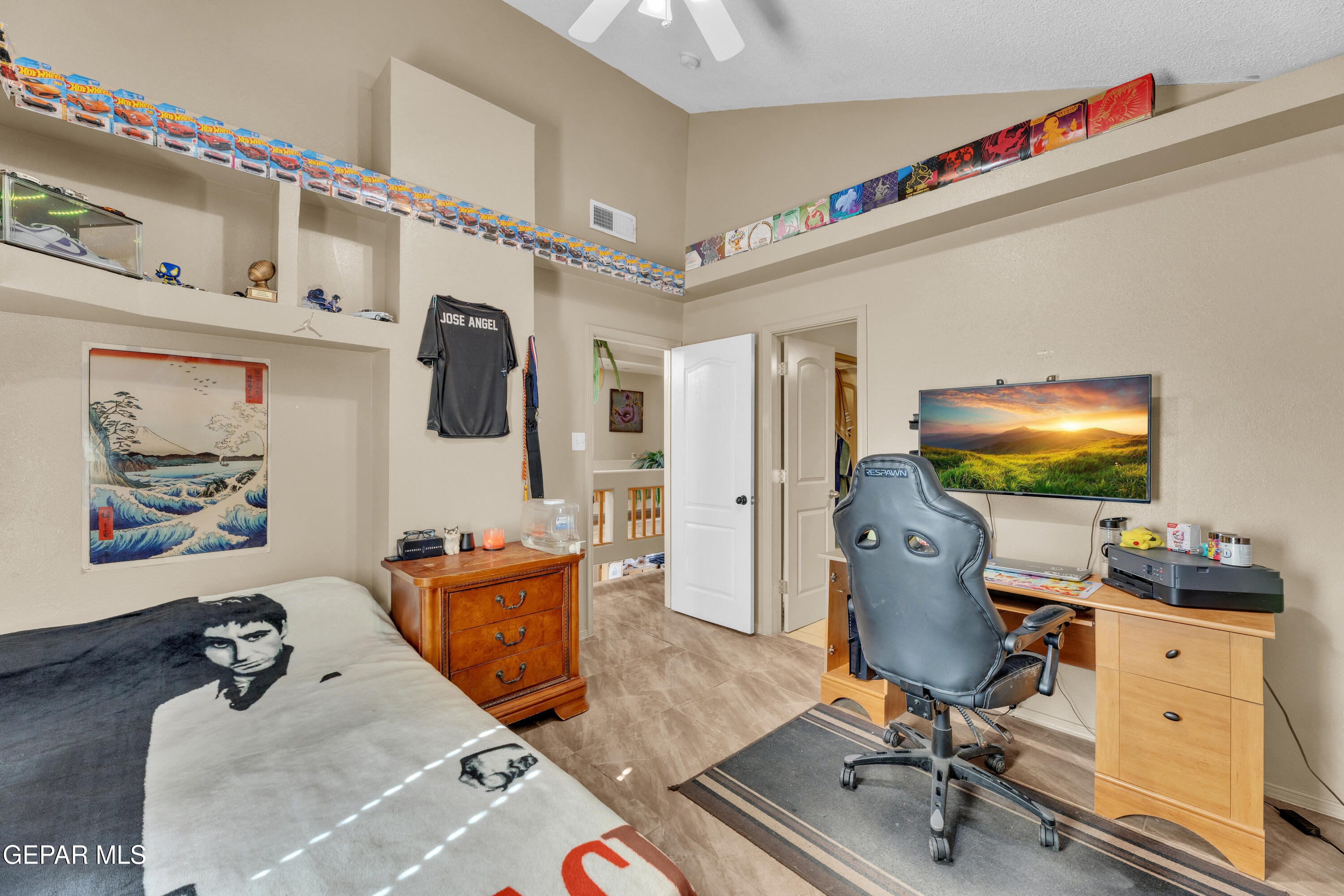 16020 Harrison Road El Paso, TX 79928 - Photo 29 of 56 a living room with furniture and a flat screen tv