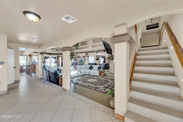 a view of a living room and entry way