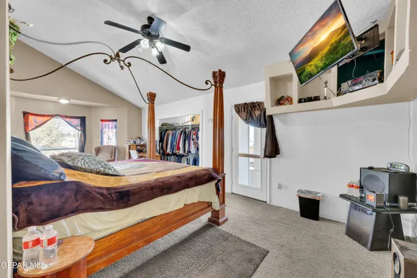 a living room with furniture a rug and a large window