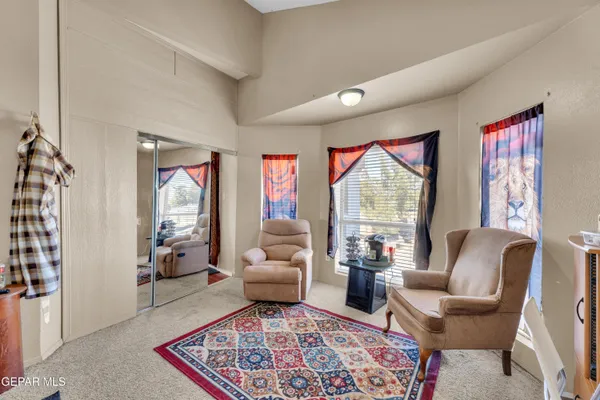a bedroom with furniture and a fireplace