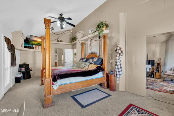 a bedroom with a bed and a dresser