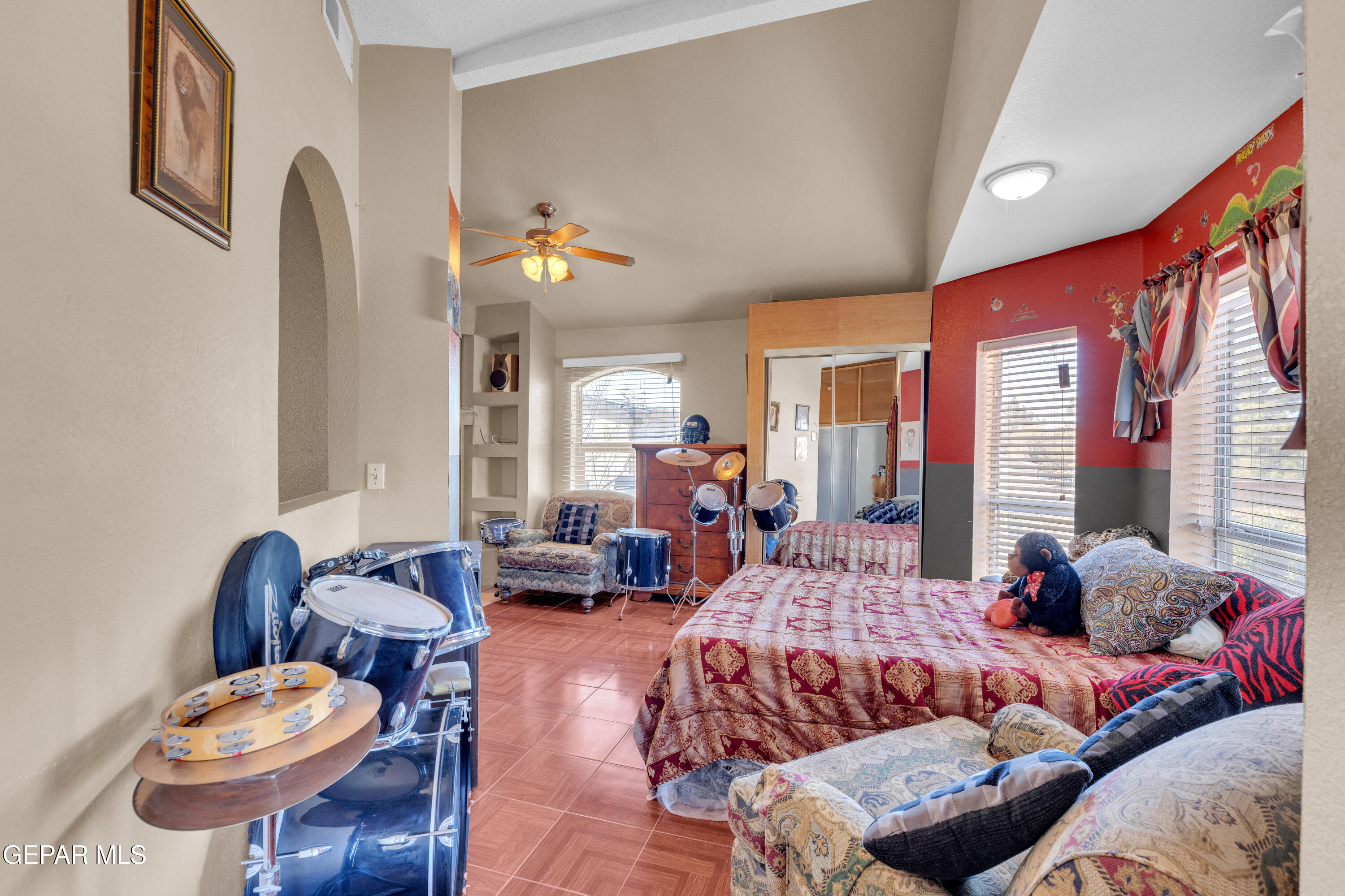 16020 Harrison Road El Paso, TX 79928 - Photo 36 of 56 a bedroom with furniture and a large window
