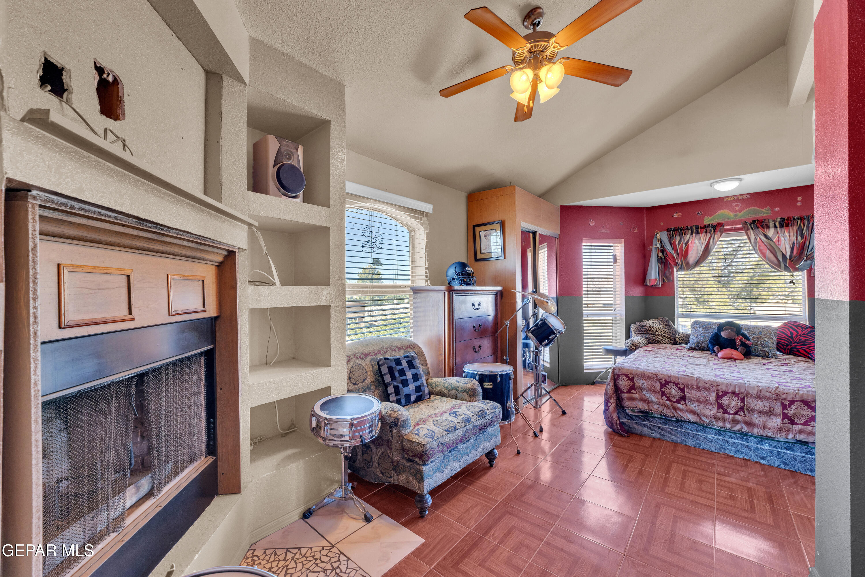 16020 Harrison Road El Paso, TX 79928 - Photo 37 of 56 a bedroom with furniture and a fireplace