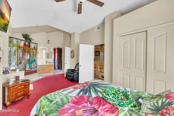 a room with furniture a flat screen tv and a window