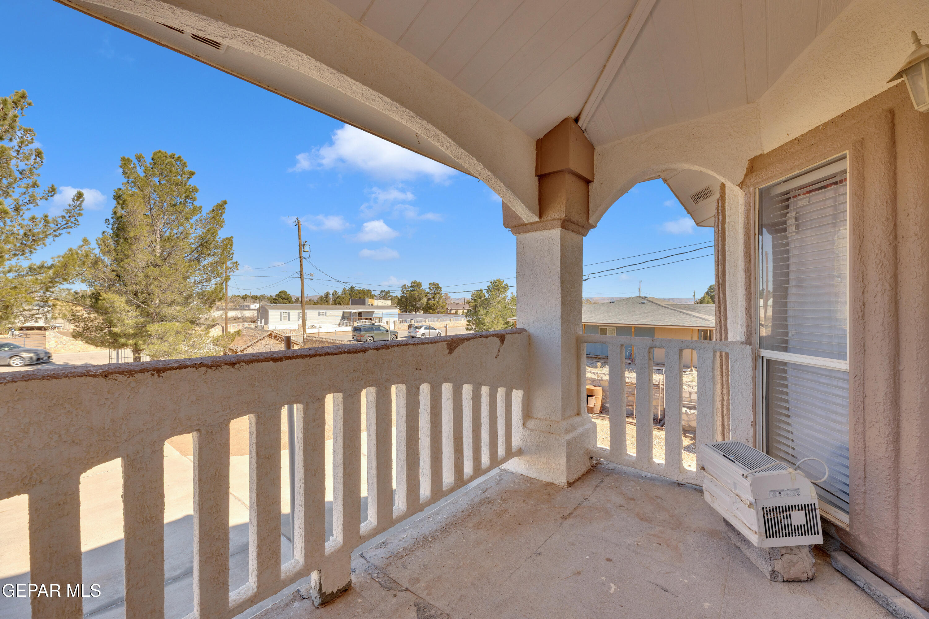 16020 Harrison Road El Paso, TX 79928 - Photo 42 of 56 a view of a balcony with wooden floor and fence