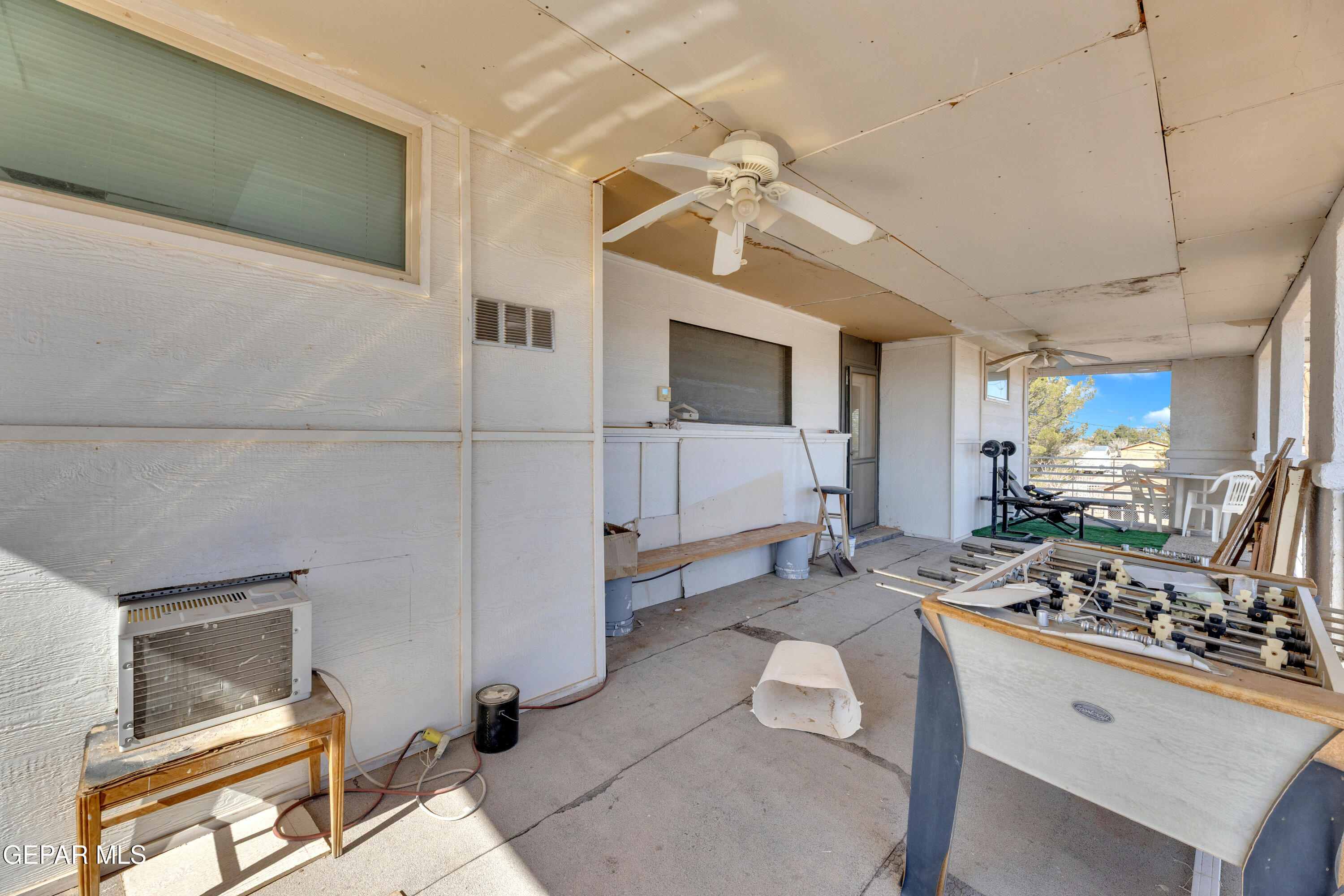 16020 Harrison Road El Paso, TX 79928 - Photo 43 of 56 a room with furniture a flat screen tv and a window