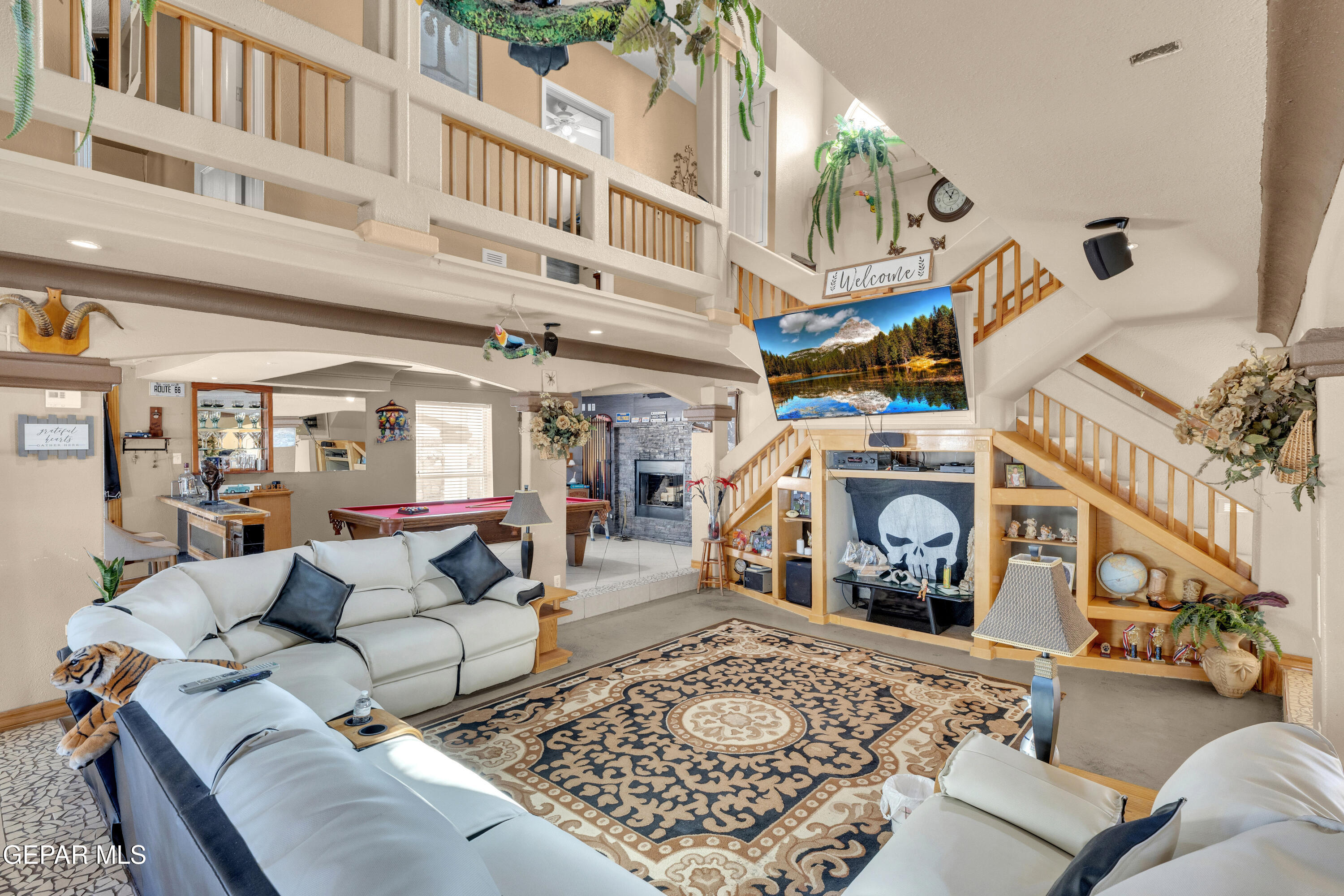 16020 Harrison Road El Paso, TX 79928 - Photo 6 of 56 a view of a living room a baby crib furniture and a fireplace