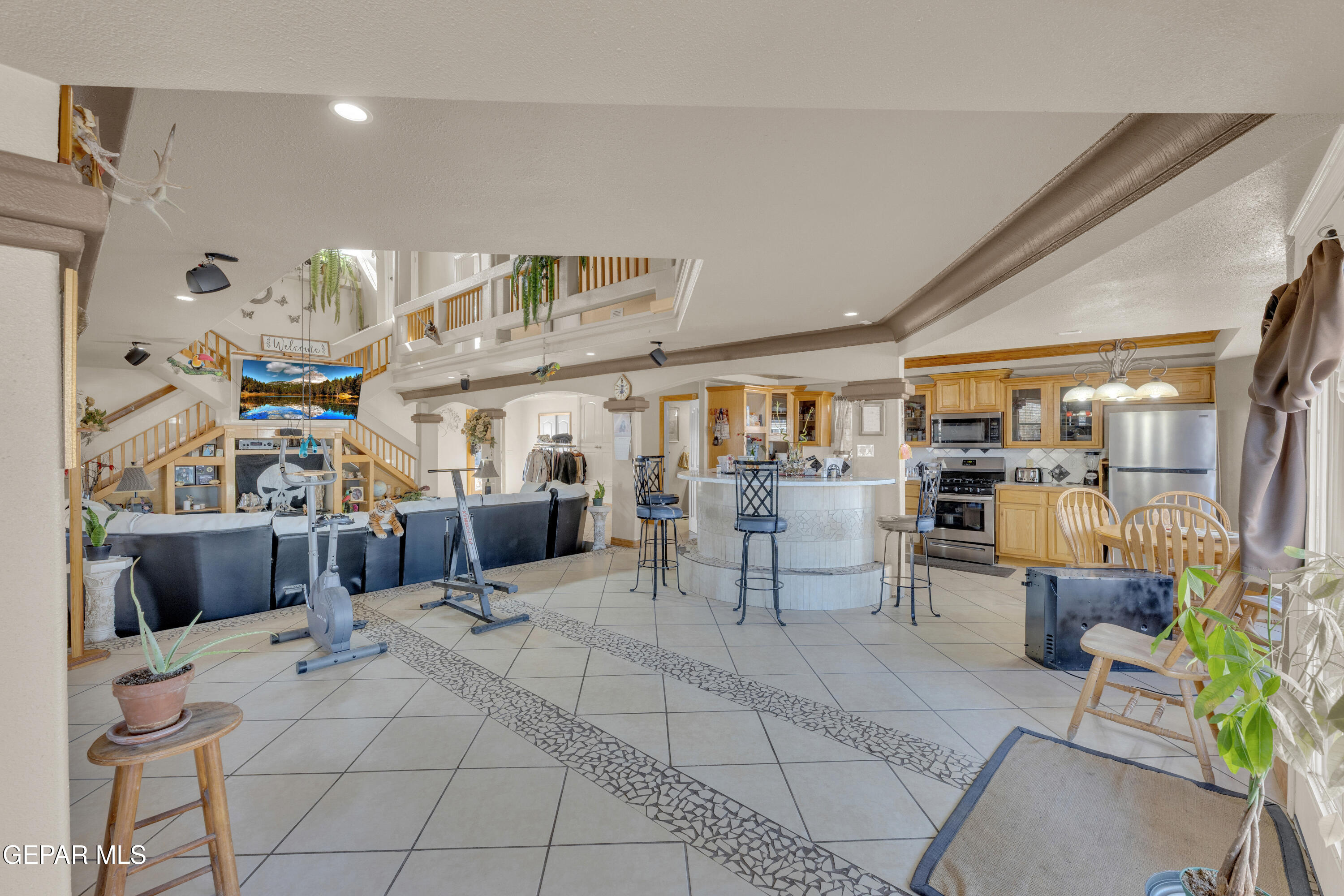 16020 Harrison Road El Paso, TX 79928 - Photo 9 of 56 a living room with lots of furniture and clutter