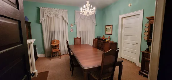 a dining room with furniture and window