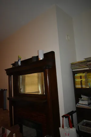 a bedroom with a bed window and couch