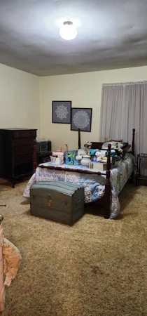 a bathroom with a sink a toilet and window