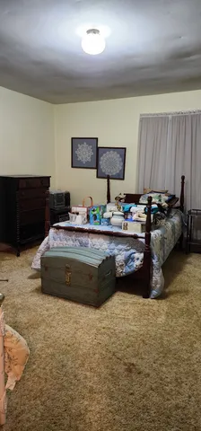 a bathroom with a sink a toilet and window