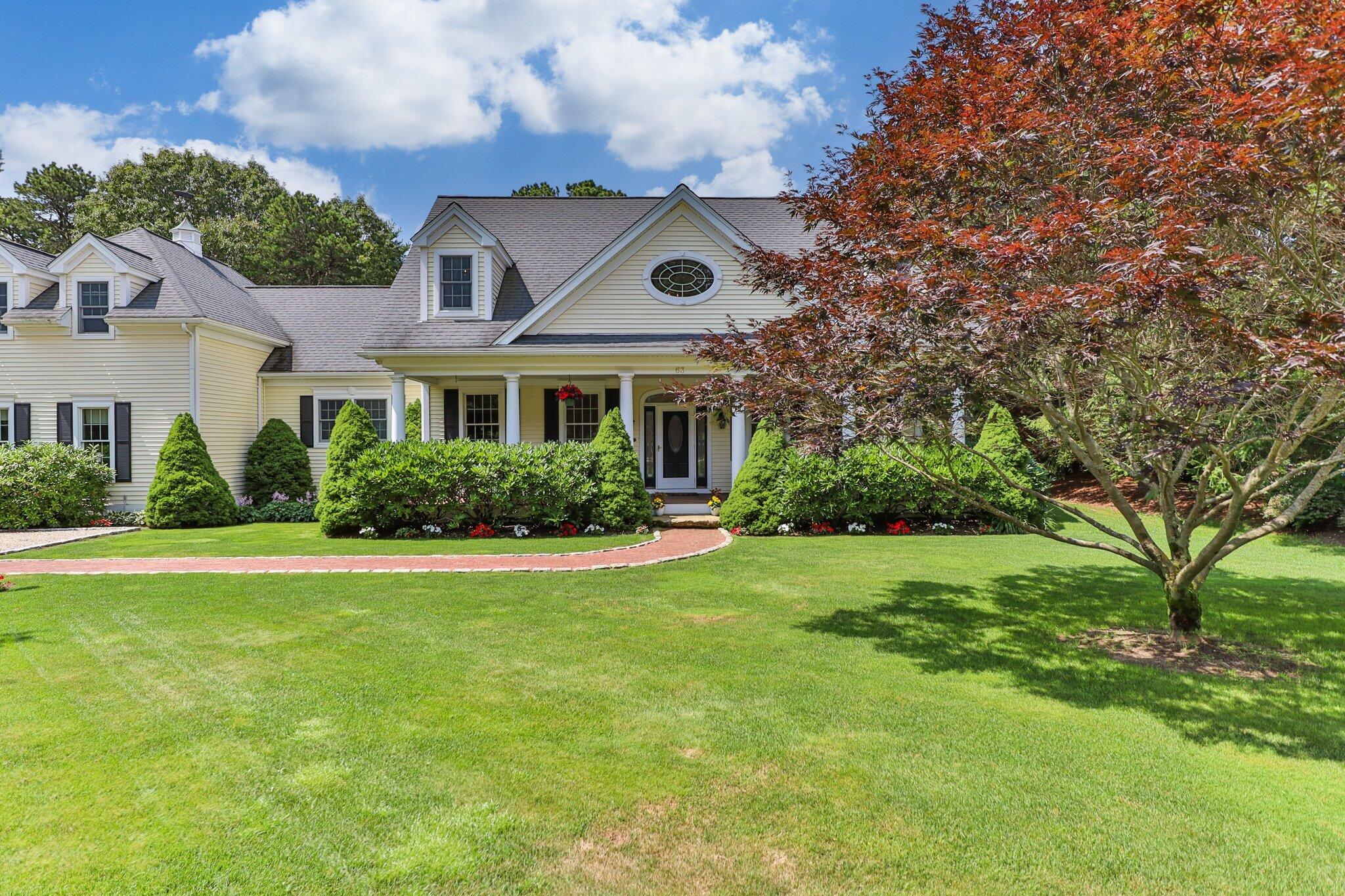 63 Farm Valley Road Osterville, MA 02655 - Photo 1 of 42 a front view of house with yard and green space