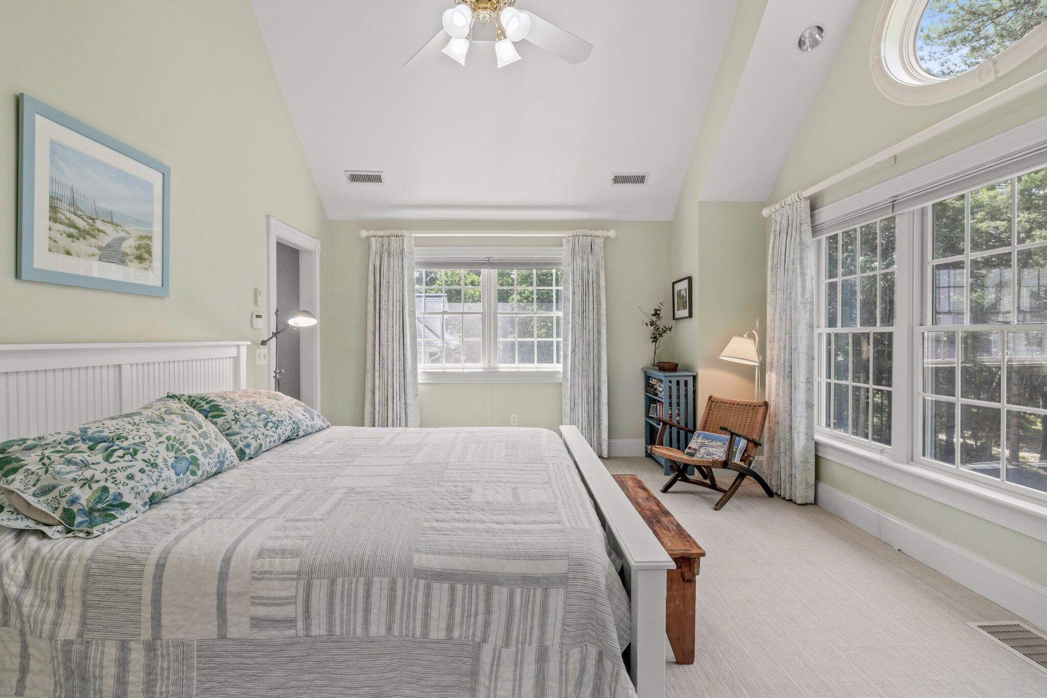 63 Farm Valley Road Osterville, MA 02655 - Photo 20 of 42 a bedroom with a bed and a large window