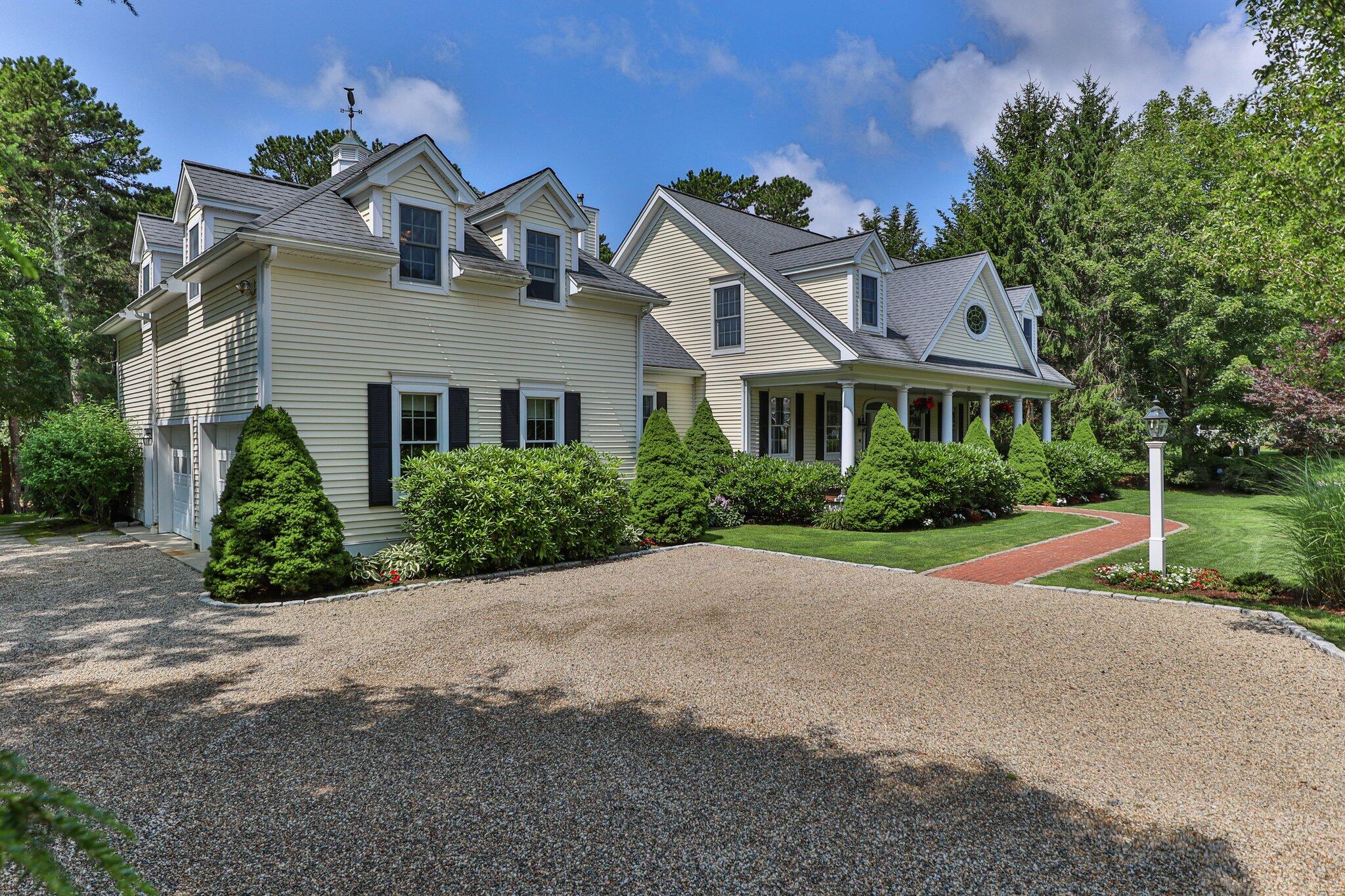 63 Farm Valley Road Osterville, MA 02655 - Photo 4 of 42 front view of a house with a yard