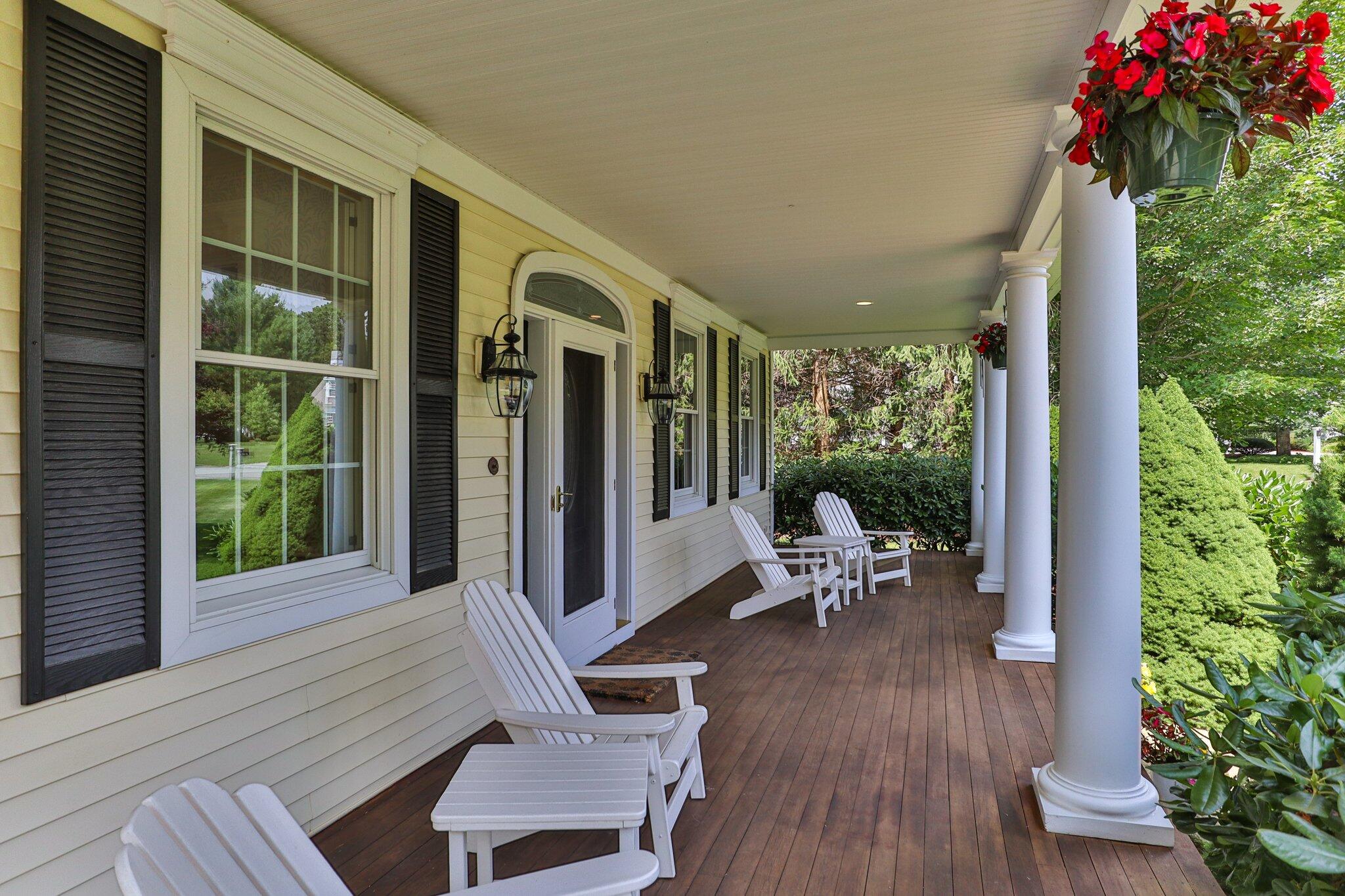 63 Farm Valley Road Osterville, MA 02655 - Photo 6 of 42 a view of a balcony with chair and wooden floor