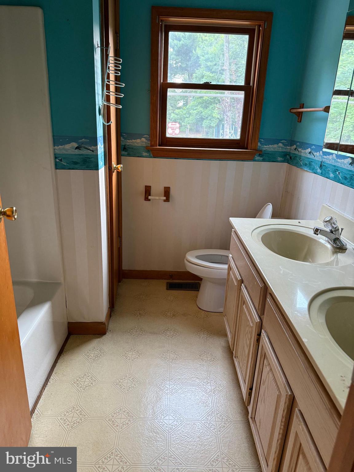 217 Carmel Road Millville, NJ 08332 - Photo 16 of 23 a bathroom with a sink and a toilet