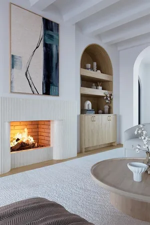 a living room with a bed furniture and a large window