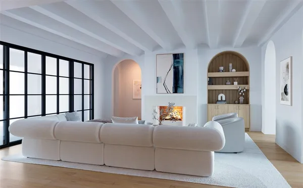 a living room with couches and a fireplace