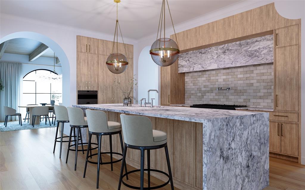 6960 Joyce Way Dallas, TX 75225 - Photo 10 of 18 a dining room with wooden floor a chandelier a wooden table and chairs