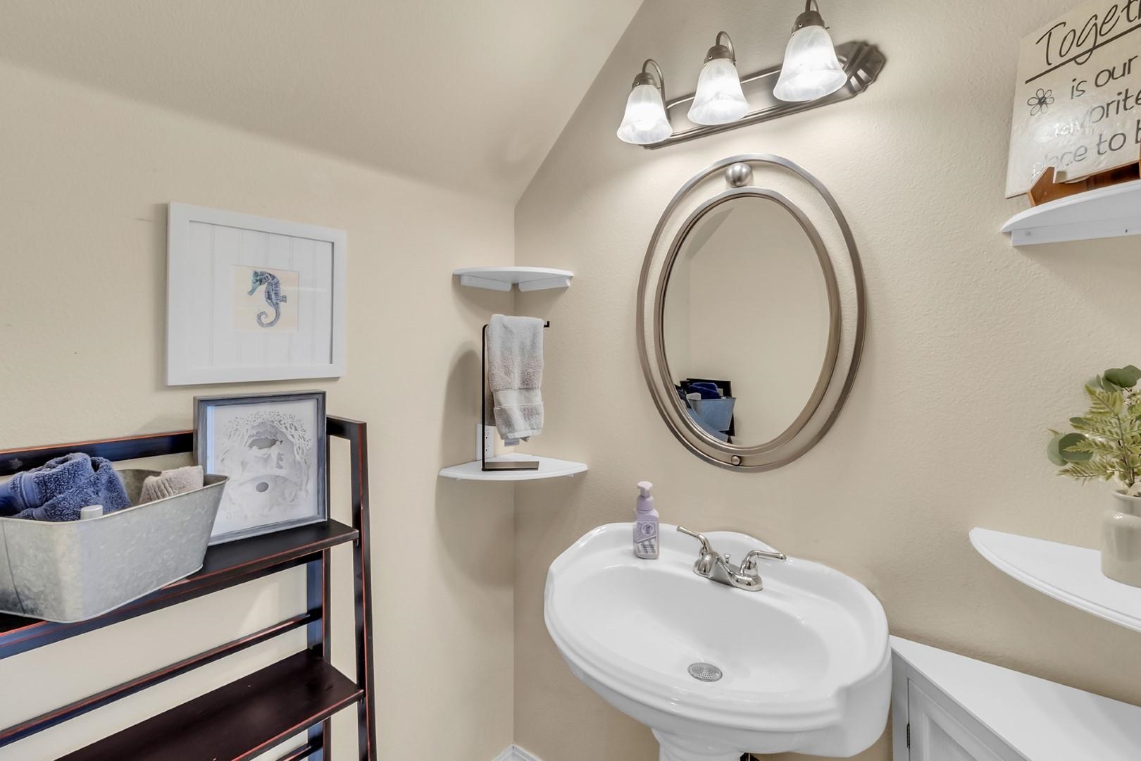 1209 Windsor Park Drive Fruita, CO 81521 - Photo 11 of 26 a bathroom with a sink and a mirror