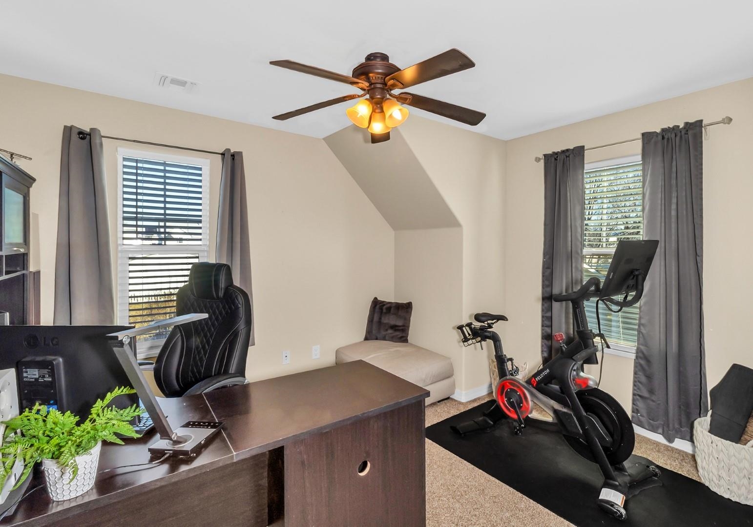 1209 Windsor Park Drive Fruita, CO 81521 - Photo 13 of 26 a view of a workspace with furniture and a window