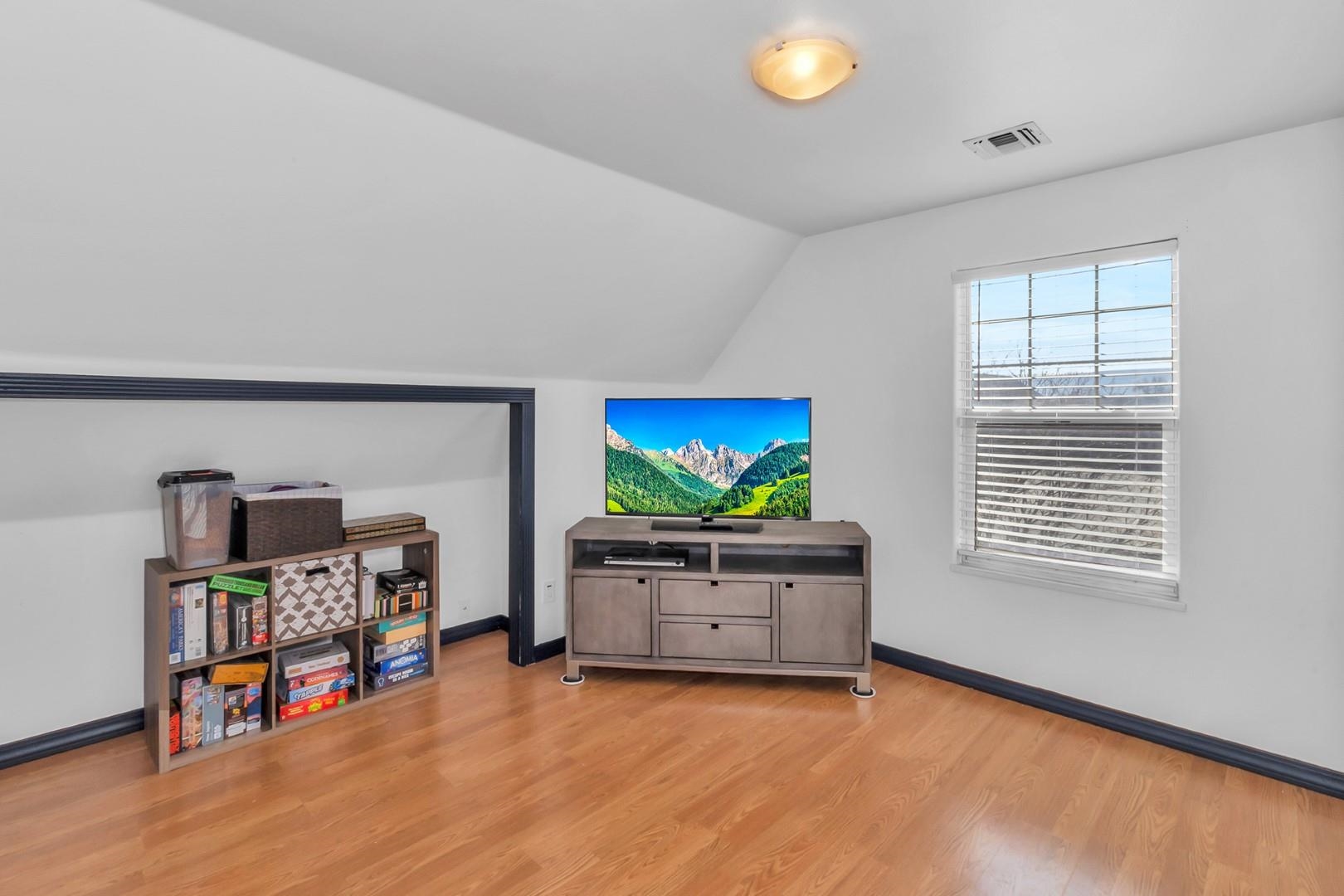 1209 Windsor Park Drive Fruita, CO 81521 - Photo 14 of 26 a view of an empty room with furniture and a flat screen tv
