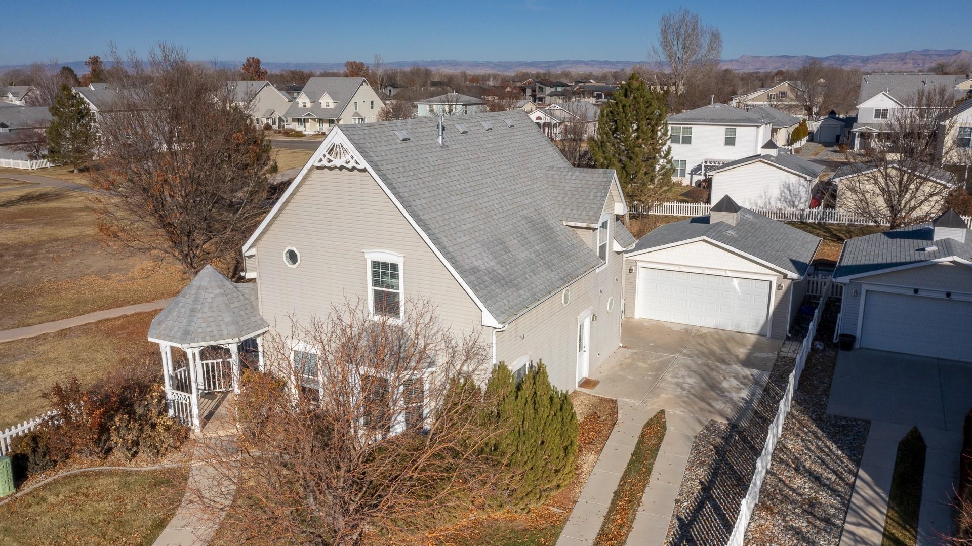 1209 Windsor Park Drive Fruita, CO 81521 - Photo 23 of 26 a view of a house with a yard