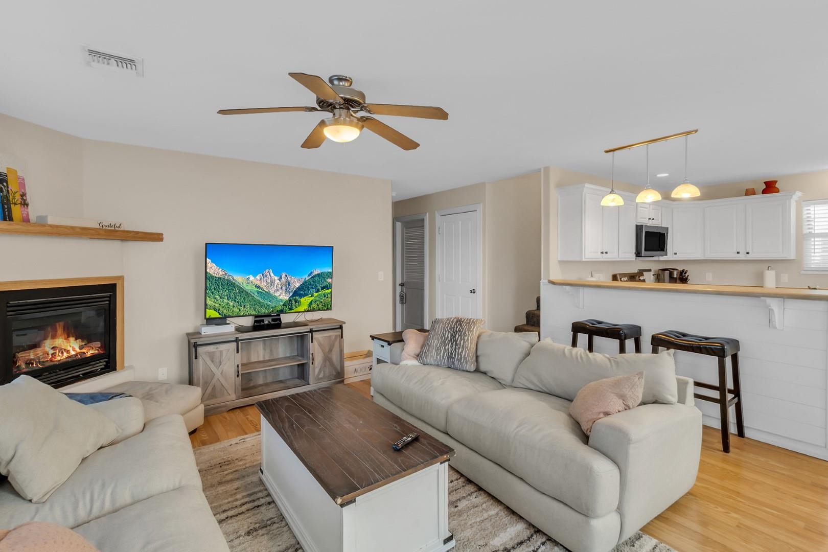 1209 Windsor Park Drive Fruita, CO 81521 - Photo 4 of 26 a living room with furniture and a flat screen tv